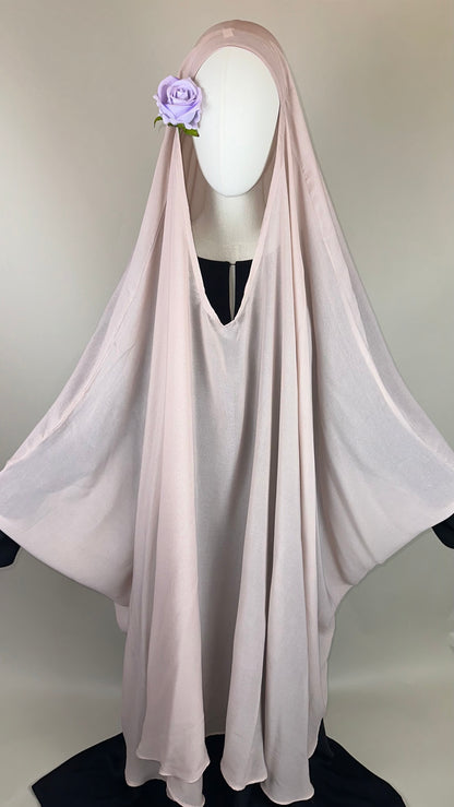 Light pink khimar with lavender flower accent on mannequin, modest Islamic fashion