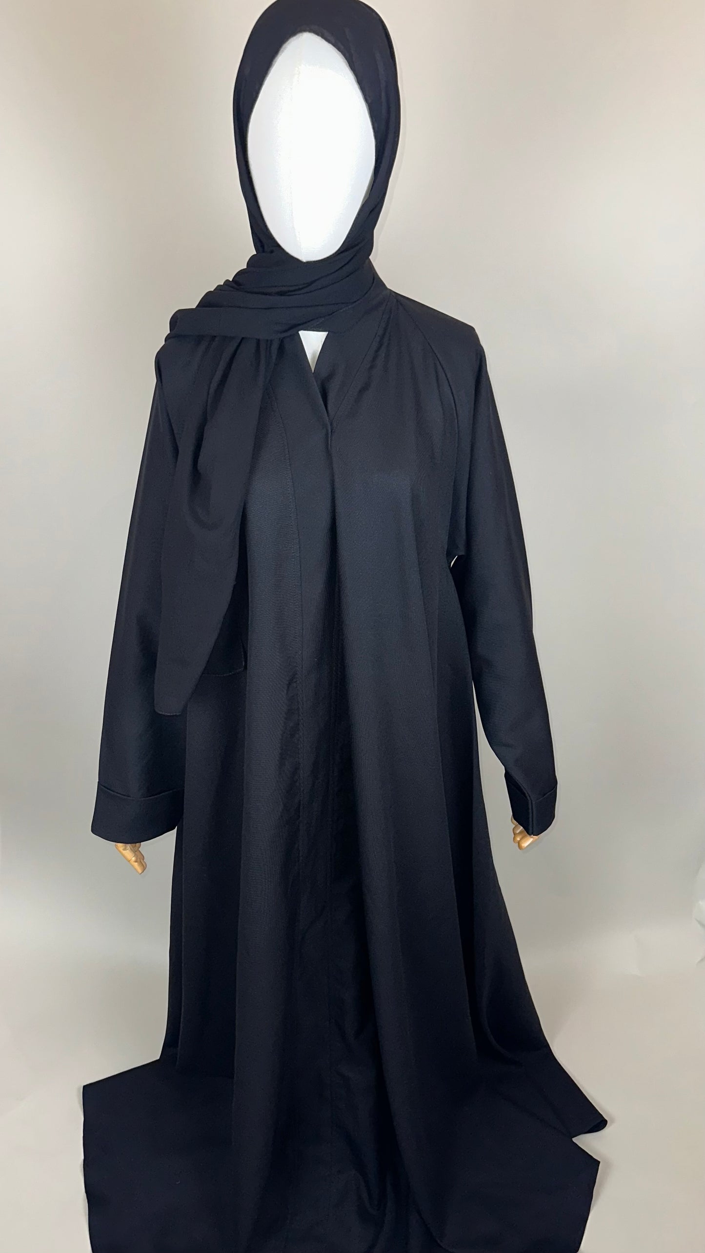 Black abaya with hijab on mannequin, full-length modest Islamic dress